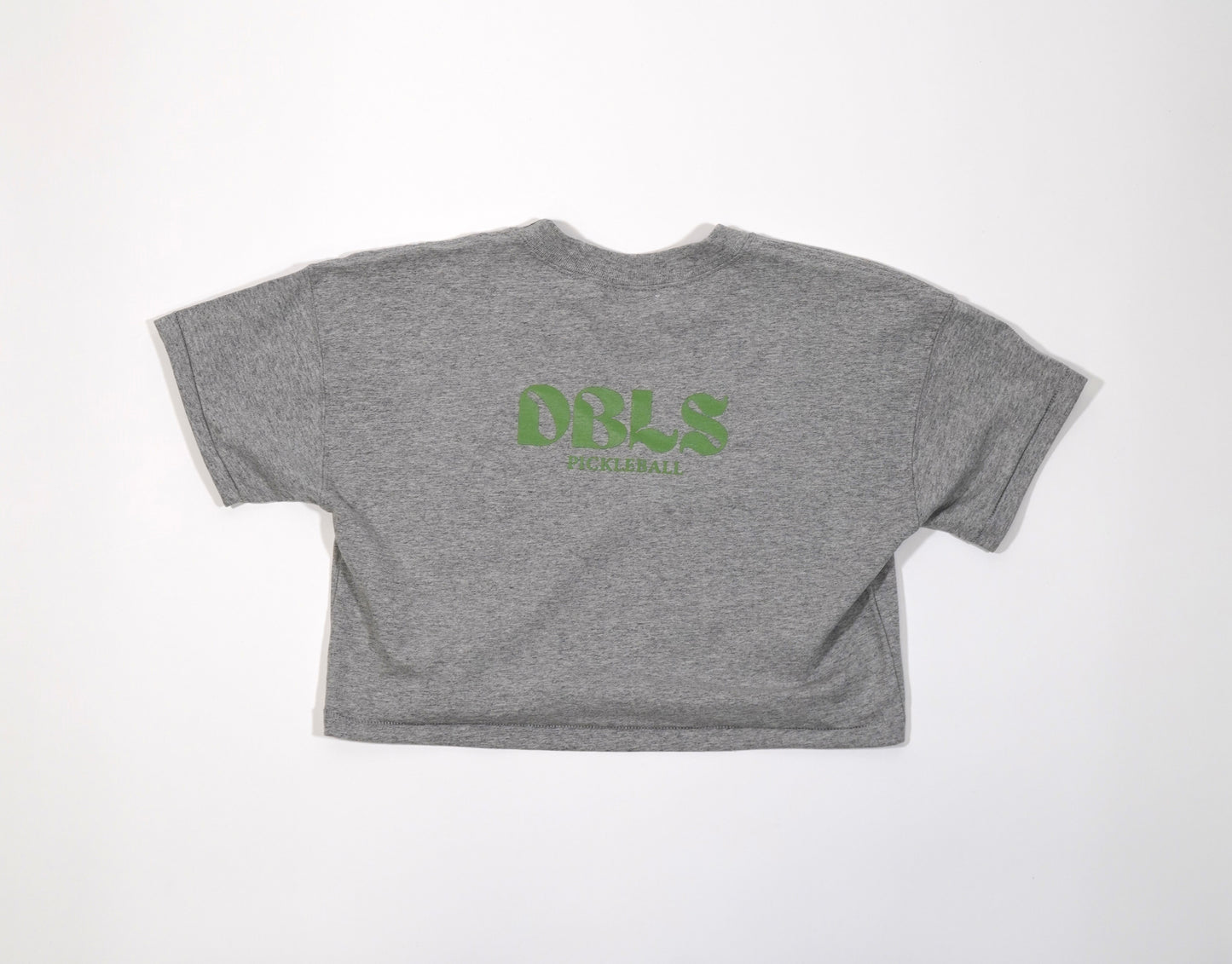 DBLS pickleball on the back of a grey cropped shirt