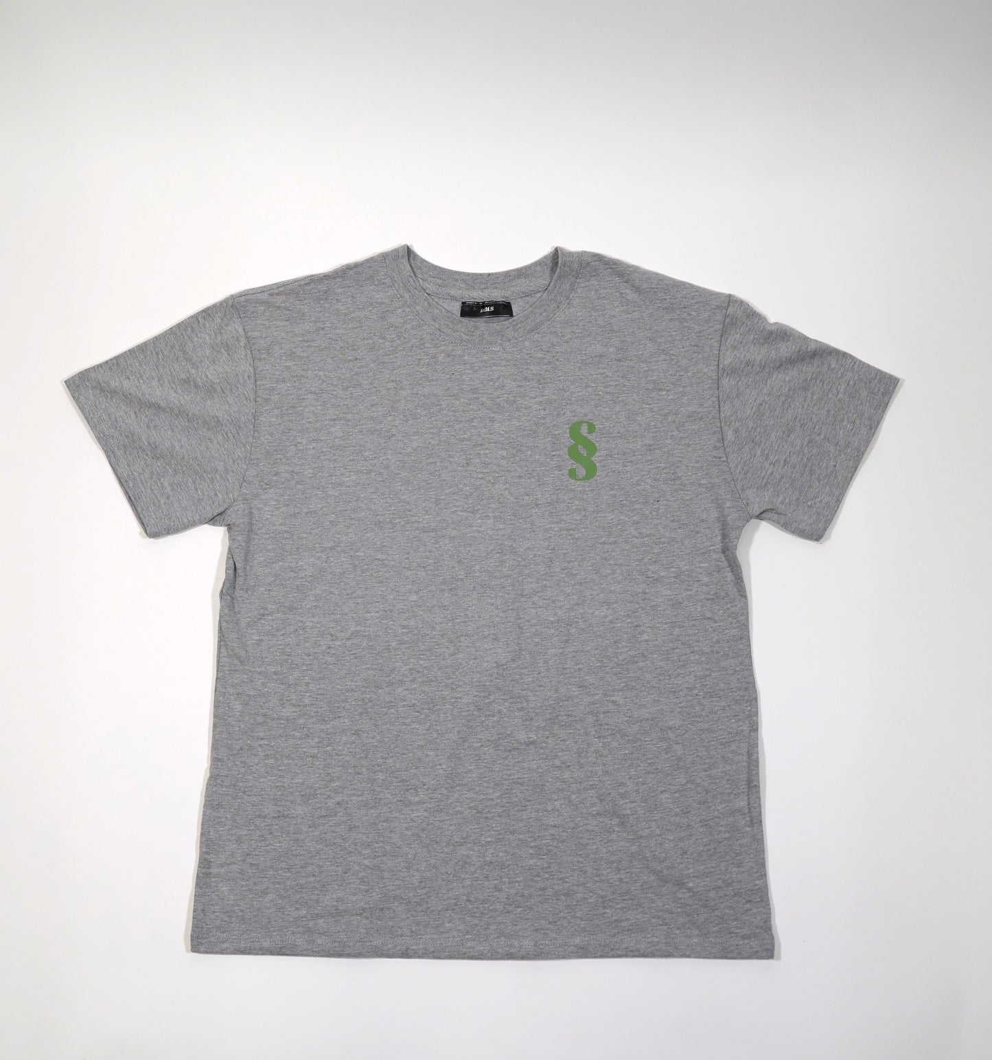 A gray oversized t-shirt with a small green 'SS' logo on the chest.