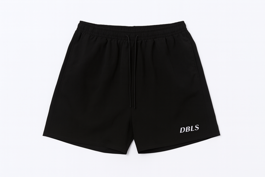 Black athletic shorts with 'DBLS' branding on a white background