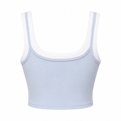 Light blue sports bra with thin straps on a white background