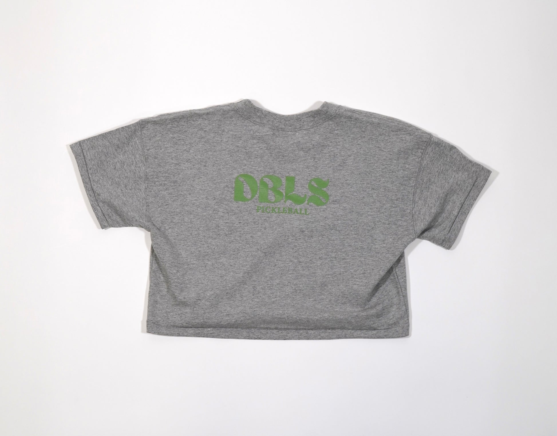 DBLS pickleball on the back of a grey cropped shirt