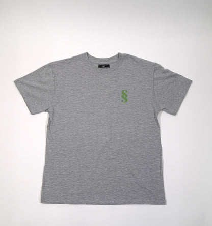A gray oversized t-shirt with a small green 'SS' logo on the chest.