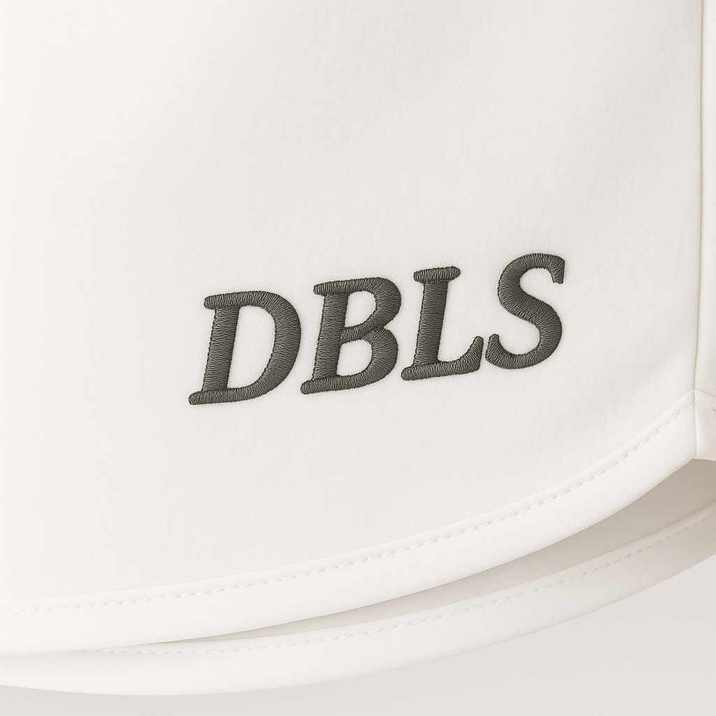 White shorts with 'DBLS' embroidered on a white background